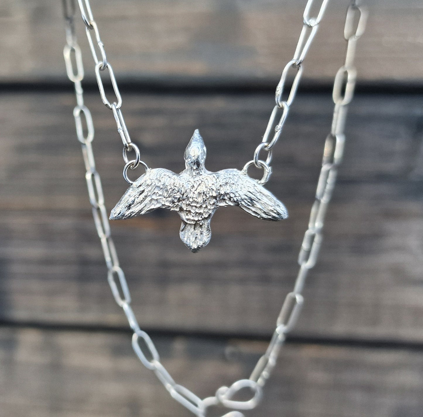 "Fri som fuglen" smykke i sølv